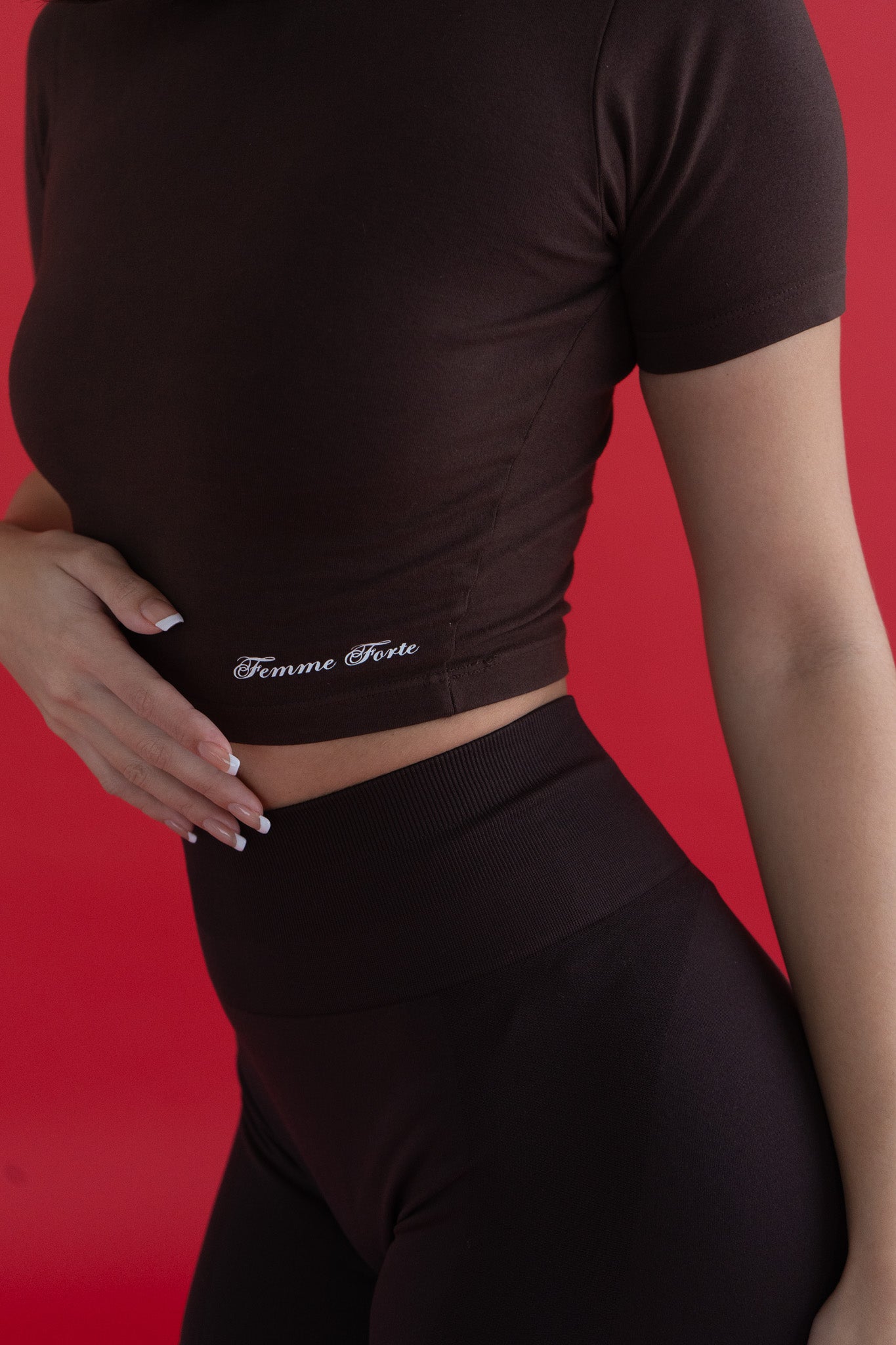 Chocolate crop top with Femme Forte logo. 